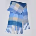 Detail of soft rainbow plaid scarf featuring long tassels and thick fuzzy knit texture - Blue and Grey