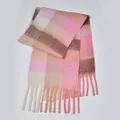 Close-up of thick plaid scarf texture with soft tassels and pink mohair-like fabric - Mixed Pink
