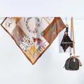 Macro detail of elegant satin square scarf featuring vintage floral and butterfly patterns - Floral Letter