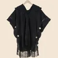 Women's black bohemian knit shawl with hood, decorative tassels and large buttons - Black