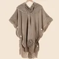 Detail of knit hooded poncho with bohemian fringe and vintage wooden buttons in khaki - Tops / 80x158cm / Coffee