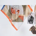 Detailed close-up of 70cm silk-like scarf with zebra print and orange geometric patterns - 70x70 / Green Orange Zebra