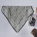 Close-up showing the leopard print pattern and satin texture of a draped scarf - 70x70cm / Black & White