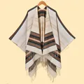 Detail of soft striped knit poncho featuring elegant tassels and earthy neutral tones - Stripe Style / Beige Striped with Tassels