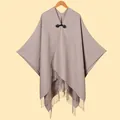 Brown knit poncho with leather buckle, tassel hem and open front design for women - Khaki