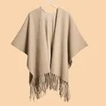 Elegant beige knit poncho for women featuring a minimalist design and stylish long fringes - Khaki