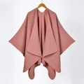 Detail view of the fine knit texture and neat edge stitching on the rose pink poncho shawl - Triangle Stitch / Pink