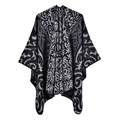 Close-up of ornate baroque scroll pattern on a thick knit winter shawl wrap - Flame Auspicious Cloud Black