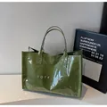 Glossy green leather tote bag with white TOTE BAG text print for women - Green
