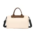 Boston-style travel bag in beige fabric with dark brown leather handles and black strap - Off White