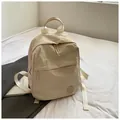 Sac à dos décontracté beige minimaliste avec grande capacité et logo M rond - Blanc Cassé