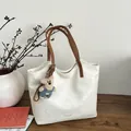 Cream white faux leather tote bag with brown straps and a cute plush bear pendant - White and Brown