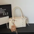Cream white matte PU leather tote bag with rivet details and cute plush bear charm - Cream White with Pendant