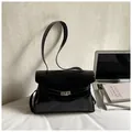 Glossy black leather oversized shoulder bag with silver turn-lock and slim strap - Black Without Charm