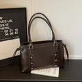 Dark brown high-gloss leather tote bag with silver rivets and sleek shoulder straps - Coffee Without Pendant