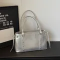 Chic silver metallic underarm bag with decorative rivets and drawstring details - Silver Without Pendant