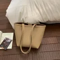 Minimalist beige textured leather tote bag with long straps for commute and shoulder wear - Khaki Without Pendant