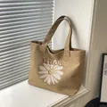 Khaki canvas tote bag with embroidered daisy and letter motif in a minimalist style - Brown