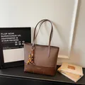 Retro brown canvas leather tote bag with ethnic bead tassel and brand logo imprint - Coffee With Pendant