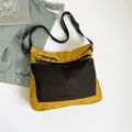 Borsa a tracolla utility di tendenza in giallo zenzero con tasca in rete nera - Giallo