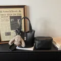 Black litchi grain bucket bag set with top handle, metal lock, and plush rabbit charm - With Pendant / Black