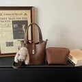 Brown litchi grain leather bucket handbag with small pouch and cute bunny charm - With Pendant / Coffee