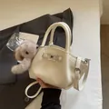 Chic white lychee grain leather handbag with silver lock and grey plush pompom charm - White With Pendant