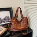 Vintage brown leather tote bag with silver cross charm and metal chain strap - Brown