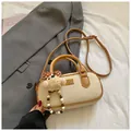 Cream white vintage bowling handbag with brown trim and cute teddy bear charm - Cream White with Pendant