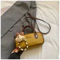 Retro yellow mini bowling bag with brown handles and a cute plush bear keychain charm - Yellowish Brown With Pendant