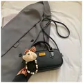 Black pebbled leather bowling bag with cute teddy bear charm and gold emblem - Black With Pendant