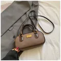 Vintage tan mini bowling bag in matte faux leather with gold metallic accents - Coffee without Pendant
