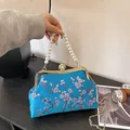Lake blue satin Chinese handle bag with plum blossom embroidery and pearl strap - Blue
