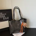 Dark grey textured faux leather tote bag with adjustable straps and hanging charms - With Pendant / Black