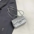 Elegant silver quilted chain bag with metallic finish and rectangular turn-lock closure - Silver