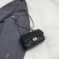 Classic black quilted crossbody bag with silver chain strap and adjustable metal bead - Black