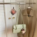 Minimalist light green shoulder bag with leather texture and cute plush bear charm - Green with Bear Pendant