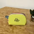 Multicolor tiered nylon travel toiletry bag with yellow front and durable handles - Yellow