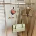 Minimalist light green baguette shoulder bag with vintage textured leather finish - Green