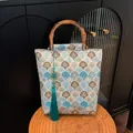 Blue and brown jacquard handbag with bamboo handle and green tassel in vintage style - White and Blue