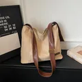 Chic beige canvas tote bag with brown leather strap and side zipper detail - Khaki