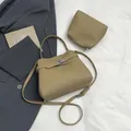 Chic khaki pebbled leather bucket bag set with silver clasp and adjustable strap - Main Bag and Pouch / Khaki