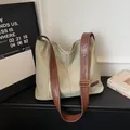 Light coffee canvas shoulder bag with brown leather strap and side zipper detail - Green