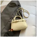 Chic cream-white crossbody bag with pebble leather texture and silver buckle detail - White Without Pendant