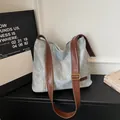 Light blue wash textured hobo tote bag with brown leather strap and golden buckle - Blue