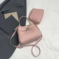 Pink lychee grain bucket bag with matching inner pouch and adjustable shoulder strap - Main Bag and Pouch / Pink