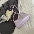 Chic light purple glossy shoulder bag with adjustable strap for modern minimalist style - Purple