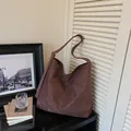 Stylish large capacity brown faux suede tote bag with an adjustable crossbody strap - Brown