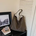 Casual dark brown suede tote bag featuring a large capacity and a stylish shoulder strap - Green