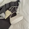 Chic cream white leather shoulder bag with silver ring handle and adjustable strap - White